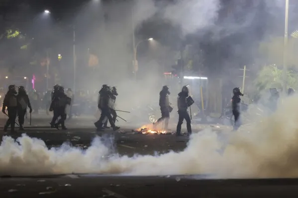 3 Killed as Mob Burns Indonesian Parliament Building